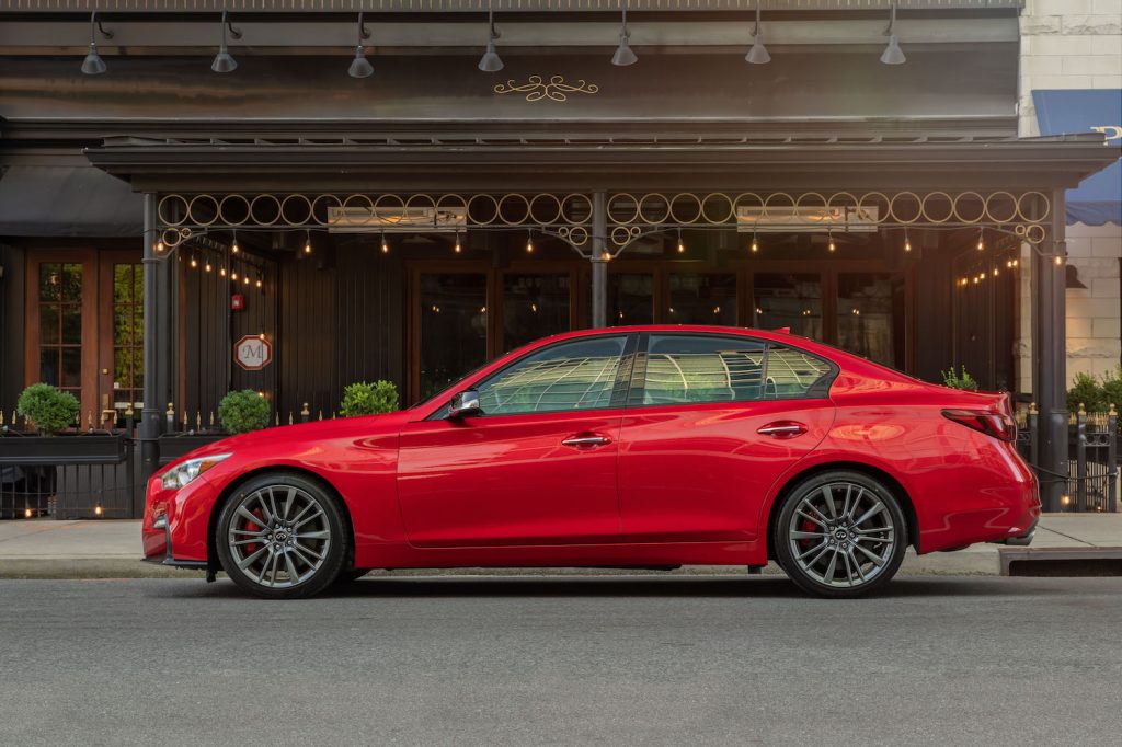 A red 2021 Infiniti Q50 parked, the Q50 is among KBB's picks for the best affordable luxury cars